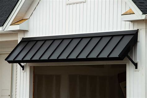 black metal awnings on houses|black metal awning over garage.